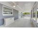 Enclosed patio with ceiling fans, offering a comfortable outdoor living space with plenty of natural light at 2736 Shannon Rd, Orlando, FL 32806