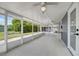 Spacious screened patio with ceiling fans, perfect for enjoying the outdoors while staying protected from insects at 2736 Shannon Rd, Orlando, FL 32806
