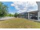 Large backyard with a screened-in pool, providing a perfect setting for relaxation and outdoor enjoyment at 275 Lakeshore Dr, Davenport, FL 33837