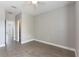 Bright bedroom featuring wood flooring, a ceiling fan, and neutral paint tones at 275 Lakeshore Dr, Davenport, FL 33837