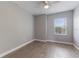 Well-lit bedroom featuring wood flooring and a bright window for natural light at 275 Lakeshore Dr, Davenport, FL 33837