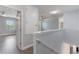 Hallway showcasing an open layout, hard surface floors, and easy access to multiple bedrooms at 275 Lakeshore Dr, Davenport, FL 33837