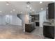 Bright kitchen features an island, stainless steel appliances, granite countertops and open layout at 275 Lakeshore Dr, Davenport, FL 33837