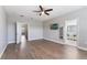 The main bedroom features wood flooring, large windows and en suite bathroom at 275 Lakeshore Dr, Davenport, FL 33837