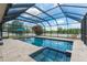 Stunning screened-in pool with a spa, offers a private outdoor oasis with ample space and natural light at 275 Lakeshore Dr, Davenport, FL 33837