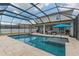 Stunning screened-in pool with ample seating and an inviting patio area at 275 Lakeshore Dr, Davenport, FL 33837