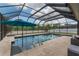 Beautiful screened-in pool and spa area, creating a serene and private retreat at 275 Lakeshore Dr, Davenport, FL 33837