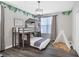 Fun bedroom with a play area, decor, and a unique bunk bed with a playful design at 2821 Bookmark Dr, Kissimmee, FL 34746
