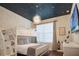 bedroom featuring a bunk bed, star-themed ceiling, and a window with a view at 2821 Bookmark Dr, Kissimmee, FL 34746