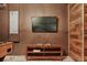 Rustic game room featuring a TV with an Xbox and wooden shelving, perfect for entertaining at 2821 Bookmark Dr, Kissimmee, FL 34746