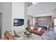 Spacious living area with a fireplace, large TV, and open layout connected to the dining area at 2821 Bookmark Dr, Kissimmee, FL 34746