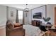 Comfortable living room with a mounted TV, a table set for four, and plush seating space at 2821 Bookmark Dr, Kissimmee, FL 34746