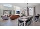 Open-concept living space features a dining area, comfortable seating, and lots of natural light at 2821 Bookmark Dr, Kissimmee, FL 34746