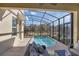 Screened in outdoor pool with a lounge area, providing a private and relaxing retreat at 2821 Bookmark Dr, Kissimmee, FL 34746