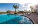 A resort-style pool with comfortable lounge chairs, tiki hut, palm trees, and inviting clubhouse at 2821 Bookmark Dr, Kissimmee, FL 34746