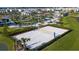 Aerial view of a sand volleyball court and resort-style amenities in this vibrant community with lush landscaping at 2821 Bookmark Dr, Kissimmee, FL 34746