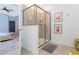 Bathroom featuring a glass enclosed shower with corner shelves and neutral tiling at 2836 Simile St, Kissimmee, FL 34746