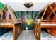 Whimsical bedroom with cabin-style bunk beds and playful forest-themed mural for imaginative play at 2836 Simile St, Kissimmee, FL 34746