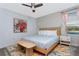Cozy bedroom with floral wallpaper, painting, stylish furniture, and lots of natural light at 2836 Simile St, Kissimmee, FL 34746
