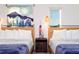 Cozy bedroom with two twin beds, stylish bedside lamps, and modern decor at 2836 Simile St, Kissimmee, FL 34746