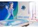 Themed bedroom featuring one bed, custom Frozen-themed wall art and ensuite bath at 2836 Simile St, Kissimmee, FL 34746