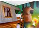 Charming bedroom featuring a custom-built bunk bed and whimsical forest-themed wall art at 2836 Simile St, Kissimmee, FL 34746