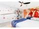 Unique bedroom featuring custom anime-themed wall art, ceiling fan, and two twin beds at 2836 Simile St, Kissimmee, FL 34746