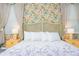 Charming bedroom featuring floral wallpaper, a decorative headboard, and bedside tables with lamps at 2836 Simile St, Kissimmee, FL 34746