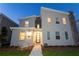 Charming two-story home with modern architectural details, beautiful stone accents and a welcoming walkway at 2836 Simile St, Kissimmee, FL 34746