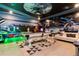 Spacious game room with space-themed wall art, a pool table, and arcade games at 2836 Simile St, Kissimmee, FL 34746