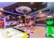 Amusement-style game room, featuring air hockey, skee ball, and wall-to-wall custom graphic design at 2836 Simile St, Kissimmee, FL 34746