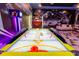 Air hockey game table and arcade game enhances this spacious and uniquely decorated entertainment room at 2836 Simile St, Kissimmee, FL 34746