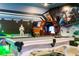 Entertaining game room with a pool table, arcade game, and comfortable seating for Gathering fun at 2836 Simile St, Kissimmee, FL 34746