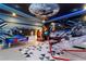 Entertaining game room with air hockey, arcade games, and custom space theme decor at 2836 Simile St, Kissimmee, FL 34746