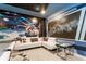 Game room featuring space-themed wall art and a comfortable white sofa at 2836 Simile St, Kissimmee, FL 34746