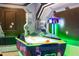 Game room featuring an air hockey table with glowing trim and colorful details at 2836 Simile St, Kissimmee, FL 34746