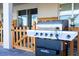 Outdoor patio featuring a Nexgrill barbecue and a charming wood fence at 2836 Simile St, Kissimmee, FL 34746