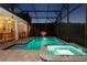 Screened pool with a basketball hoop and an attached spa at 2836 Simile St, Kissimmee, FL 34746