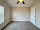 Cozy bedroom with neutral walls, carpeted floors, and a ceiling fan at 3049 Buckeye Pointe Dr, Winter Haven, FL 33881