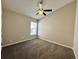 This bedroom has neutral walls, carpet flooring and a ceiling fan with light at 3049 Buckeye Pointe Dr, Winter Haven, FL 33881