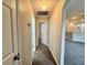 Carpeted hallway with neutral paint connects living spaces within the home at 3049 Buckeye Pointe Dr, Winter Haven, FL 33881