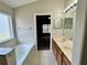 The ensuite bathroom offers a large soaking tub and a double sink vanity at 3049 Buckeye Pointe Dr, Winter Haven, FL 33881