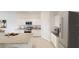 Modern kitchen featuring stainless steel appliances, white cabinets, and granite countertops at 3251 Nightfall Rd, Winter Haven, FL 33881