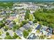Wide aerial view of a neighborhood featuring well-maintained homes, lush landscaping, and community amenities at 3813 Goldenglow Dr, Orlando, FL 32828
