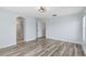 Light and airy bedroom with wood floors and access to hallway at 3813 Goldenglow Dr, Orlando, FL 32828