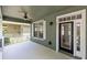 Inviting front porch with a ceiling fan, offering a relaxing outdoor space to enjoy the neighborhood views at 3813 Goldenglow Dr, Orlando, FL 32828