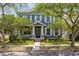 Charming two-story home with lush landscaping, sidewalk and inviting front porch and a gray facade at 3813 Goldenglow Dr, Orlando, FL 32828