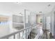 Hallway and stairway boasting new floors and light neutral paint at 3813 Goldenglow Dr, Orlando, FL 32828