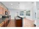 Well-equipped kitchen with sleek countertops, stainless steel appliances, and stone accent wall, ideal for cooking at 3813 Goldenglow Dr, Orlando, FL 32828