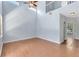 Spacious living room with high ceilings, natural light, and wood laminate flooring, creating an inviting space at 3813 Goldenglow Dr, Orlando, FL 32828